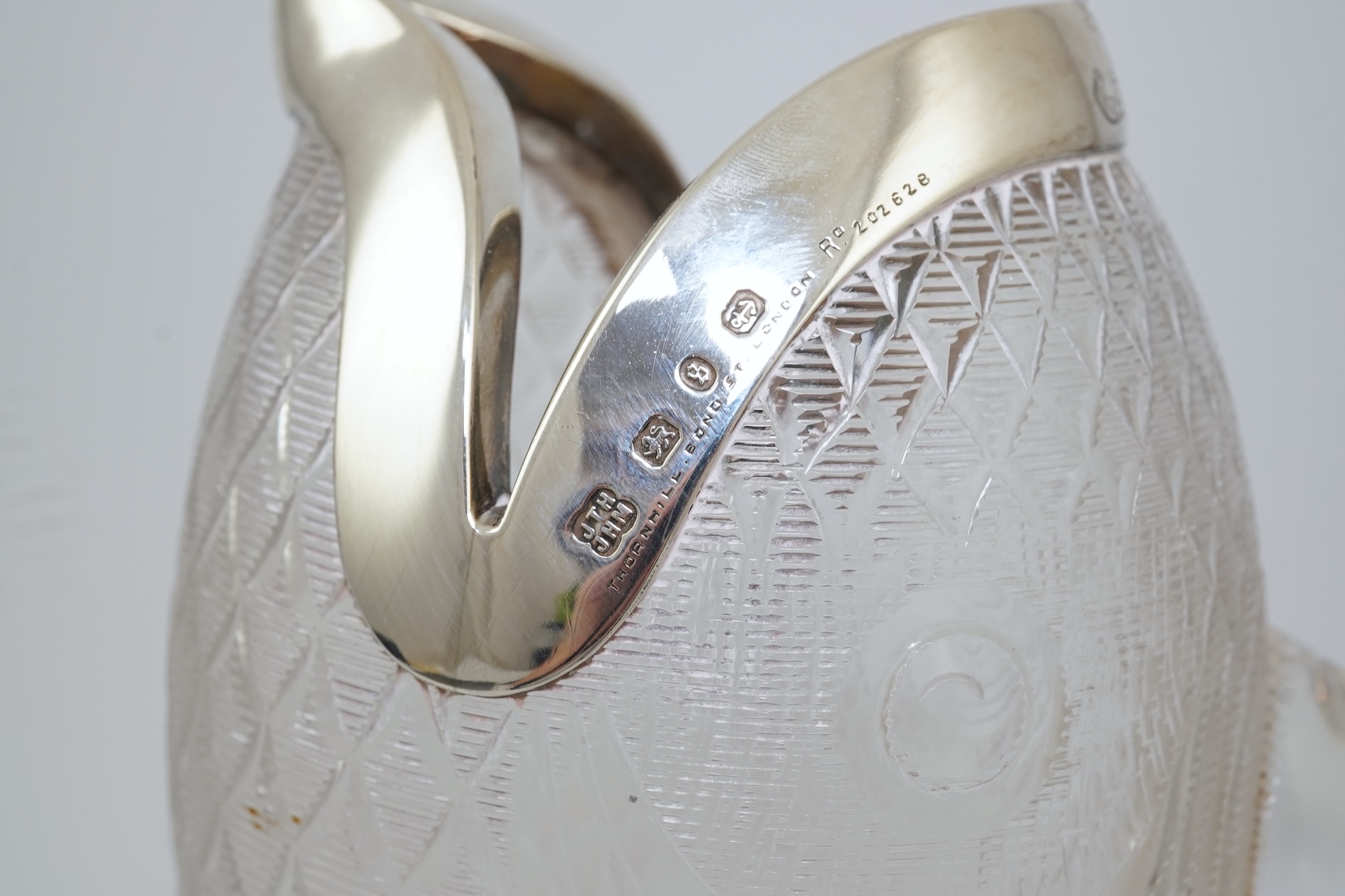 An unusual late Victorian novelty silver mounted single handled cut glass jug, modelled as a fish, by Hukin & Heath
